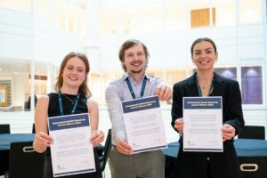 Award winners holding their certificates