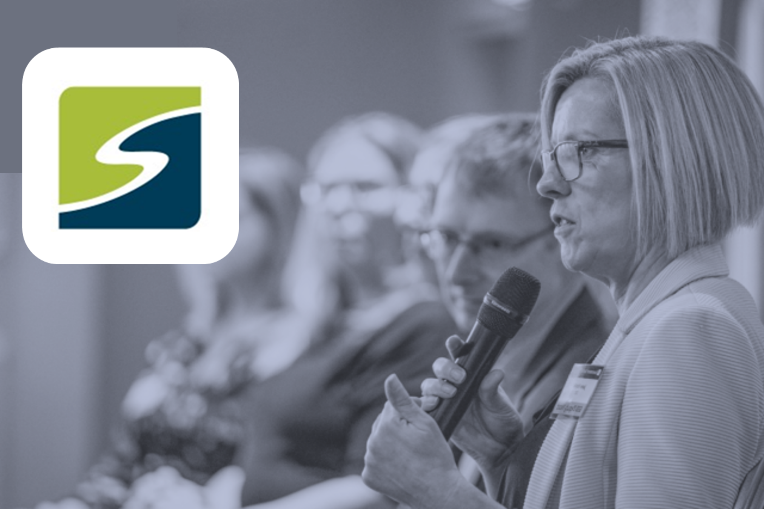 Jane Naylor speaking into a microphone